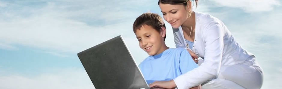 Woman and boy using laptop.